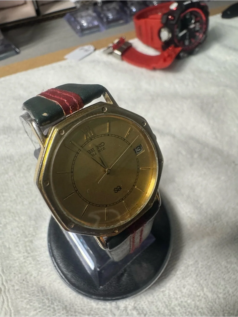 Seiko Gold Dial Watch with Black Strap and Red Stitch